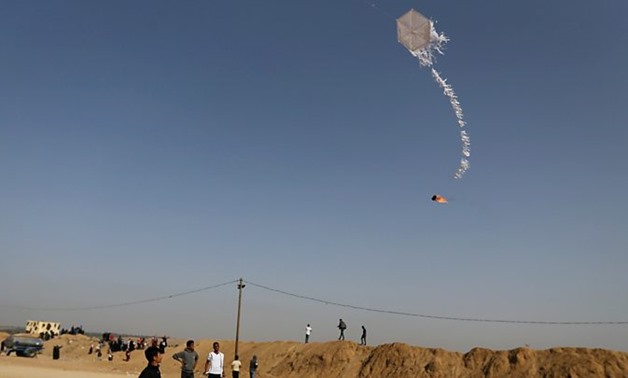 Israel halts fuel shipments to Gaza citing continued fire balloon launches - Reuters