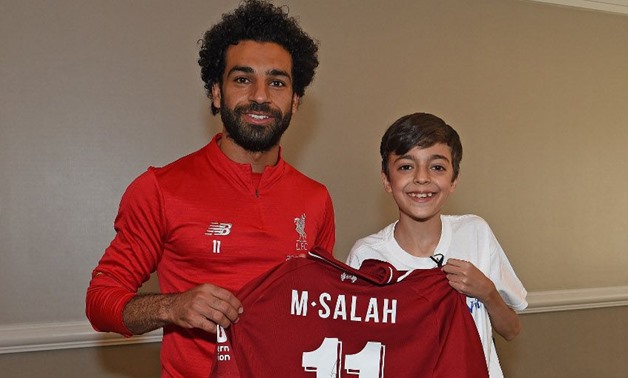 Salah meets Ammar and gives him a signed shirt - Photo courtesy of Liverpool FC 