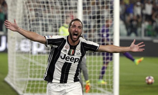 Juventus' Gonzalo Higuain celebrates after scoring against Fiorentina. REUTERS/Max Rossi
