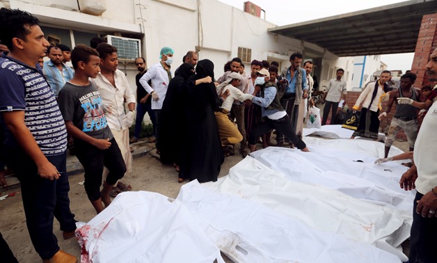 Relatives of victims gather around their bodies outside a hospital morgue after an air strike hit a fish market in Hodeidah, Yemen August 2, 2018. REUTERS/Abduljabbar Zeyad