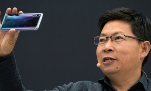 Huawei CEO Richard Yu said the company shifted 95 million smartphones in the first six months of the year - AFP 
