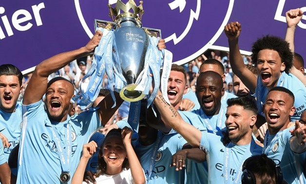 Manchester City players celebrate their 2018 Premier League title
AFP/File / Paul ELLIS
