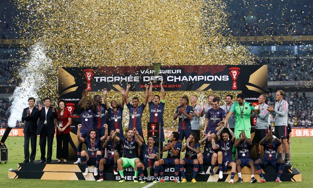 Soccer Football - French Super Cup Trophee des Champions - Paris St Germain v AS Monaco - Shenzhen Universiade Sports Centre, Shenzhen, China - August 4, 2018 Paris St Germain celebrate with the trophy after winning the French Super Cup REUTERS/Bobby Yip