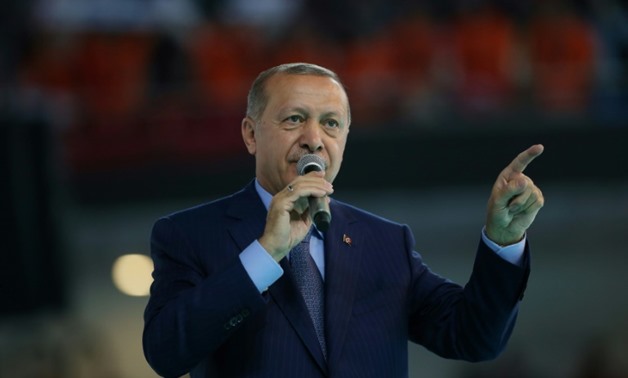 Turkish President Tayyip Erdogan says Turkey will impose sanctions on two US officials as a row over the detention of an American pastor escalates
