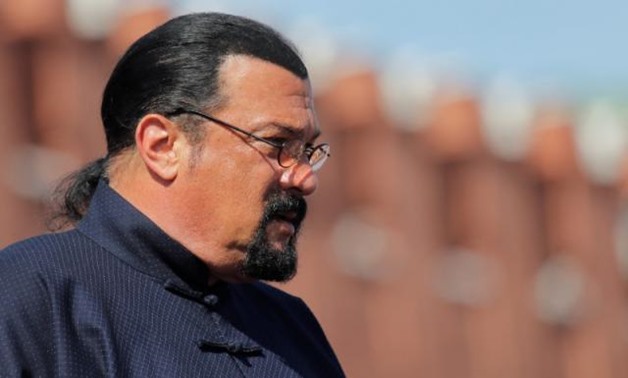 U.S. actor Steven Seagal watches the Victory Day parade, marking the 73rd anniversary of the victory over Nazi Germany in World War Two, at Red Square in Moscow, Russia May 9, 2018. REUTERS/Maxim Shemetov.