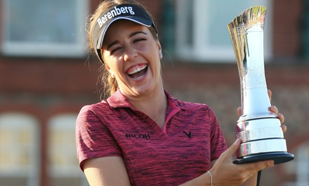England's Georgia Hall poses with the 2018 Women's British Open trophy - AFP / Lindsey PARNABY