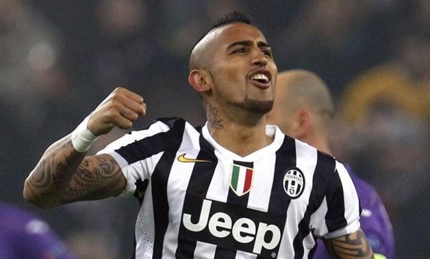 Juventus' Arturo Vidal celebrates after scoring against Fiorentina's during their Europa League round of 16 first leg soccer match at the Juventus stadium in Turin on March 13, 2014. REUTERS/Alessandro Garofalo 