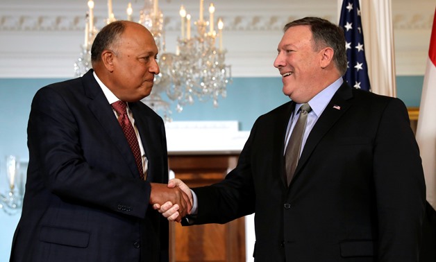 U.S. Secretary of State Mike Pompeo shakes hands with Egyptian Foreign Minister Sameh Shoukry before their meeting at the State Department in Washington, U.S., August 8, 2018. REUTERS/Yuri Gripas