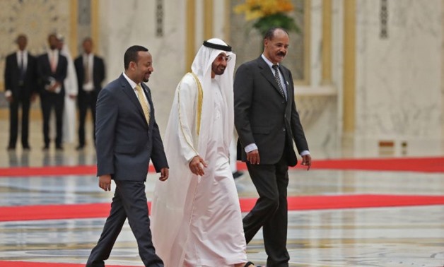 Abu Dhabi's Crown Prince Sheikh Mohamed bin Zayed Al-Nahyan (C) receives Ethiopian Prime Minister Abiy Ahmed (L) and Eritrean President Isaias Afwerki (R) at the presidential palace in the UAE capital on July 24, 2018 (AFP Photo/KARIM SAHIB)