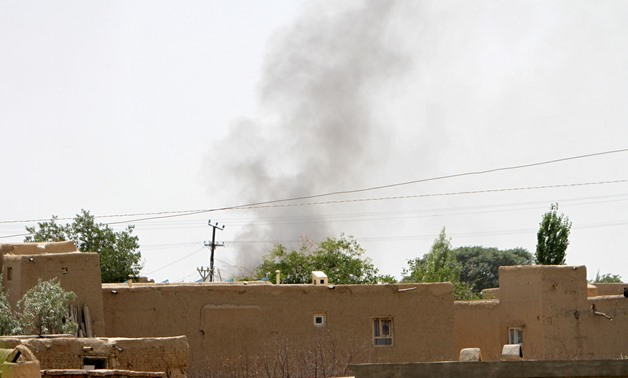Smoke rises from a residential area where gun battle is going on between Taliban and Afghan forces in Ghazni province, Afghanistan August 10, 2018. REUTERS/Stringer