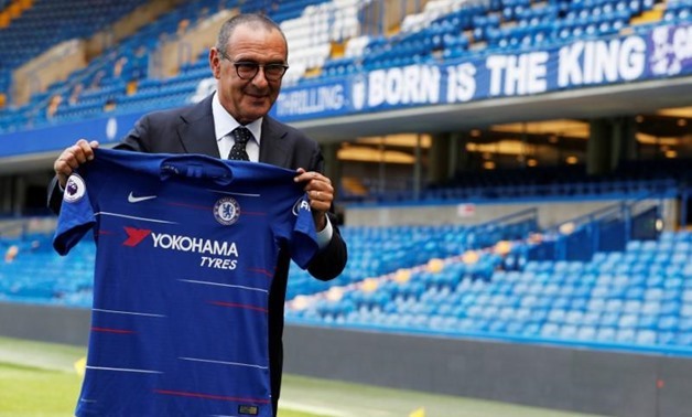 Soccer Football - Premier League - Chelsea present new manager Maurizio Sarri - Stamford Bridge, London, Britain - July 18, 2018 New Chelsea manager Maurizio Sarri poses with the club shirt after the press conference Action Images via Reuters/John Sibley
