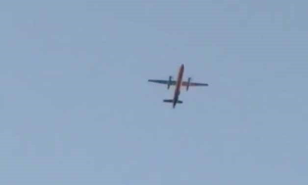 A Horizon Air Bombardier Dash 8 Q400, reported to be hijacked, flies over Fircrest, Washington, the U.S., before crashing in the South Puget Sound, August 10, 2018 in this still image taken from a video obtained from social media. Leah Morse/via REUTERS T
