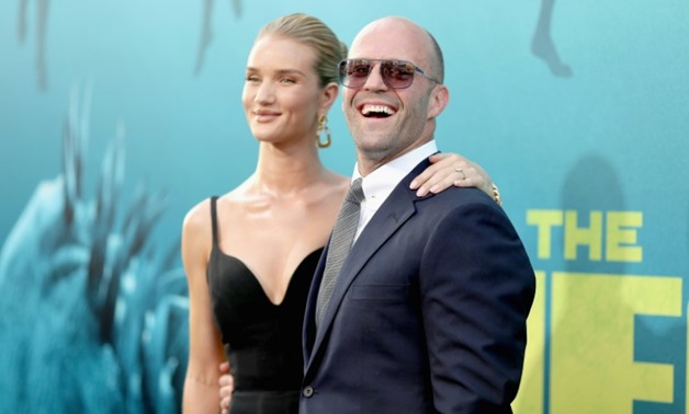 Jason Statham (R) stars in 'The Meg' as a rescue diver who tries to save scientists in a nuclear submarine from a huge, underwater shark attack