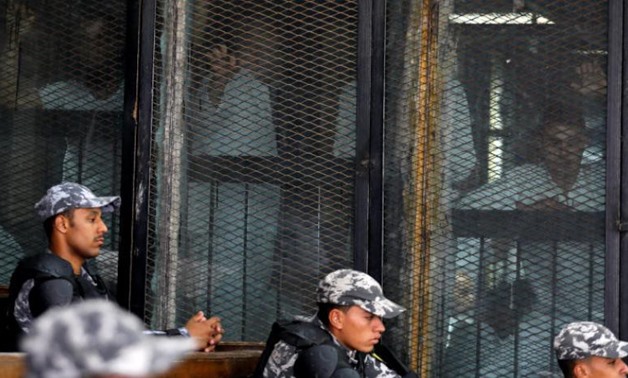 Defendants and police at the Cairo Criminal Court. Reuters file photo