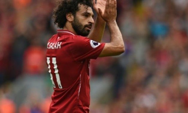 © AFP | Egyptian star Mohamed Salah could be in hot water after Liverpool passed on video footage to police apparently showing him using his mobile phone whilst driving