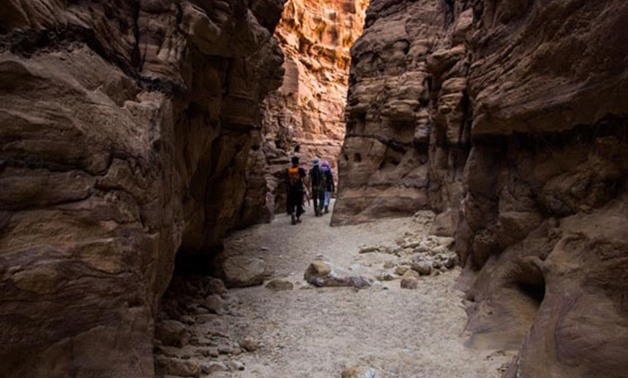 Tourists are walking through the mountains in Darb Sinai - Press photo