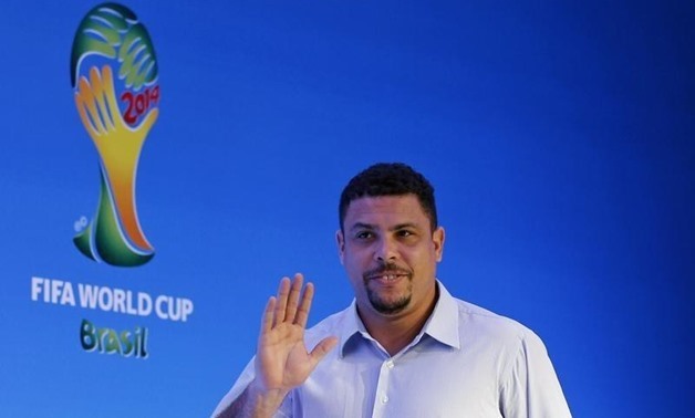 Former Brazilian soccer player Ronaldo waves as he arrives at a news conference ahead of the draw for the 2014 World Cup at the Costa do Sauipe resort in Sao Joao da Mata, Bahia state, December 5, 2013 – REUTERS/Sergio Moraes
