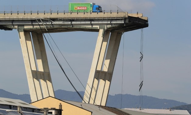 The disaster left one driver's green lorry perched precariously close to the precipice. The 37-year-old driver told Italian media how he had escaped the "hell" of the bridge collapse
