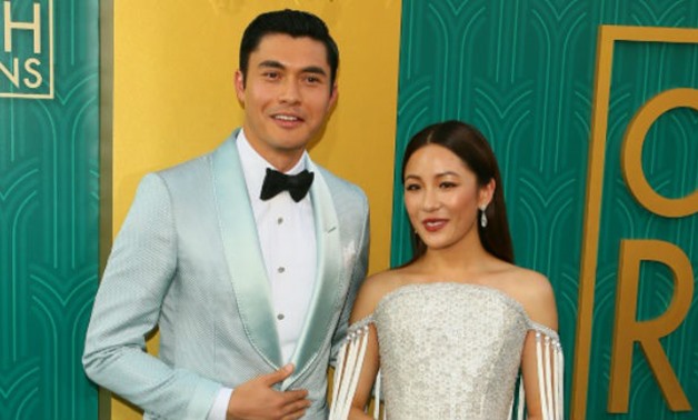 Actors Henry Golding (L) and Constance Wu star in "Crazy Rich Asians," a two-hour celebration of fabulous wealth, stunning clothes and idealized love, complete with heroine who has to out-fox her beau's imperious mother and vicious ex-girlfriend-AFP / JEA