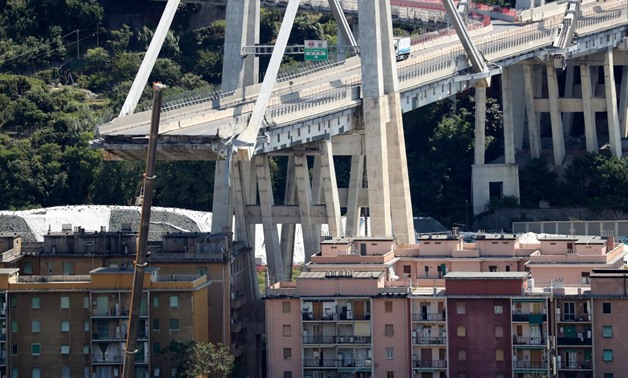 The collapsed Morandi Bridge is seen in the port city of Genoa, Italy August 16, 2018. REUTERS/Stefano Rellandini
