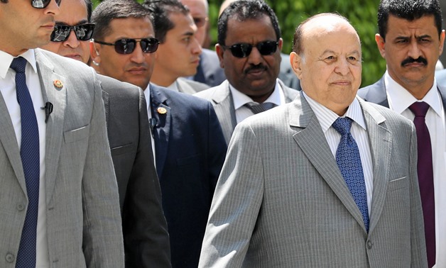 Yemeni President Abd-Rabbu Mansour looks on as he is surrounded by security after his meeting with Arab League Secretary General Ahmed Aboul Gheit in Cairo, Egypt August 14, 2018. REUTERS/Mohamed Abd El Ghany