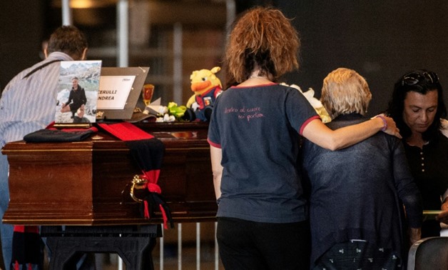 Authorities plan a state funeral service and mass for the dead on Saturday at a hall in Genoa, coinciding with a day of mourning
