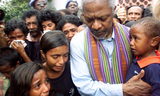 FILE PHOTO - United Nations Secretary-General Kofi Annan consoles family members of victims of last April's massacre by pro-Indonesia militia in Liquisa, 30 km west of DIli February 17, 2000. REUTERS/Darren Whiteside