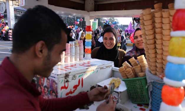 Young women buying ice cream, celebrating Eid al-Adha in Cairo - Photo by Ahmed Maarouf/Egypt Today