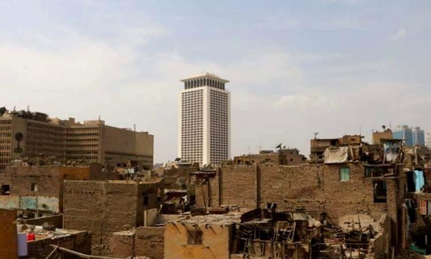 FILE – Part of slums in Maspero Triangle, Ministry of Foreign Affairs can be seen in the background
