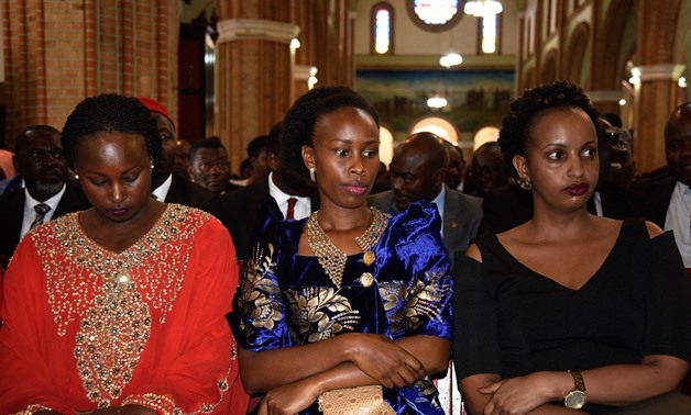 Barbie Kyagulanyi (C), wife of prominent opposition politician Robert Kyagulanyi known as Bobi Wine, attends the prayer for her husband at Rubaga Cathedral Church in Kampala on August 22, 2018.-AFP/  ISAAC KASAMANI