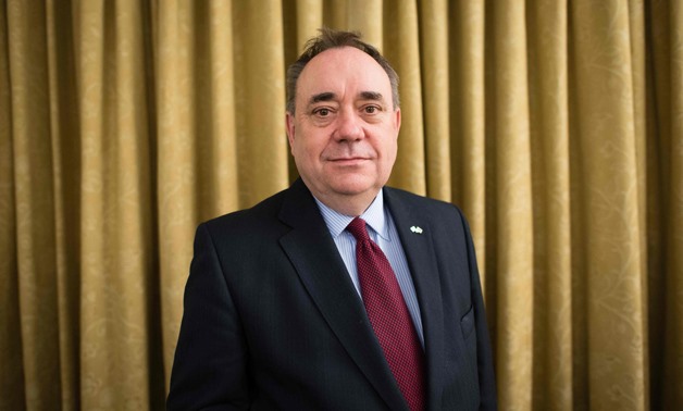  (FILES) In this file photo taken on March 15, 2016 former First Minister of Scotland, and current Scottish National Party (SNP) MSP for Aberdeenshire East, Alex Salmond poses for a photograph in his London office- / AFP / LEON NEAL
