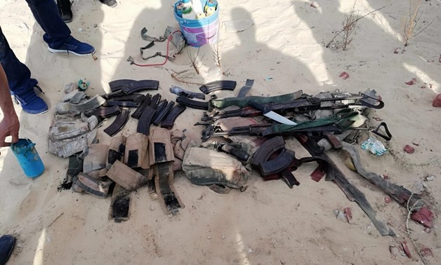 The forces also seized 10 improvised explosive devices, four guns, a number of home-made bombs, RPG rifles, three explosive belts, a surveillance camera, and a cell phone - Press Photo