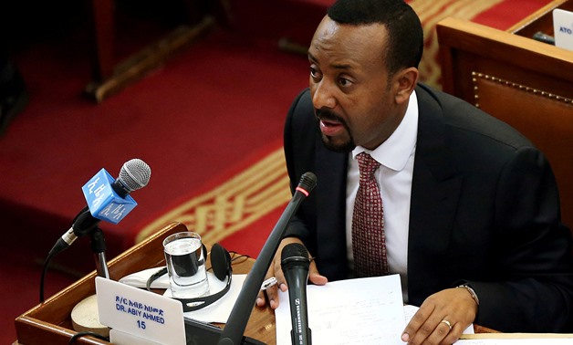FILE PHOTO: Ethiopia's newly elected Prime Minister Abiy Ahmed addresses the members of parliament inside the House of Peoples' Representatives in Addis Ababa, Ethiopia April 19, 2018. REUTERS/Tiksa Negeri