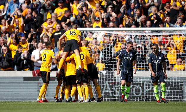 Soccer Football - Premier League - Wolverhampton Wanderers v Manchester City - Molineux Stadium, Wolverhampton, Britain - August 25, 2018 Wolverhampton Wanderers' Willy Boly celebrates scoring their first goal with teammates Action Images via Reuters/Carl