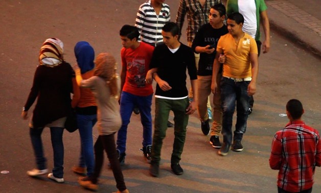 FILE: Young men harassing girls in a street