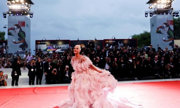 The 75th Venice International Film Festival - Screening of the film "A Star is Born" out of competition - Red Carpet Arrivals - Venice, Italy, August 31, 2018 - Actor and singer Lady Gaga poses. REUTERS/Tony Gentile.
