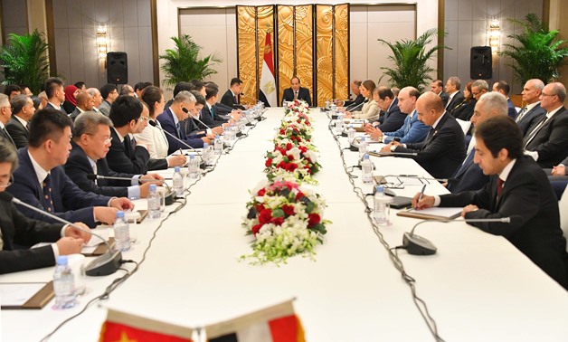 President Abdel Fatah al-Sisi during meeting with Chinese businessmen and economists, alongside top Egyptian officials in Beijing on September 2, 2018 - Press photo/Presidency