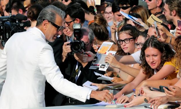 The 75th Venice International Film Festival - Screening of the film "The Mountain" competing in the Venezia 75 section - Red Carpet Arrivals - Venice, Italy, August 30, 2018 - Actor Jeff Goldblum signs autographs. REUTERS/Tony Gentile.