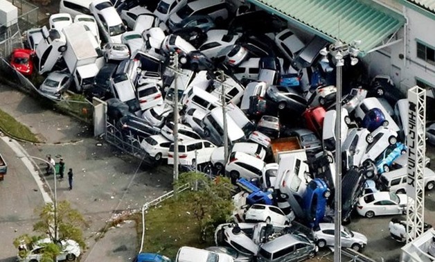 Vehicles damaged by Typhoon Jebi are seen in Kobe, western Japan, in this photo taken by Kyodo September 5, 2018. Kyodo/via REUTERS
