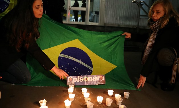 People light candles for presidential candidate Jair Bolsonaro after he was stabbed by a man in Juiz de Fora at Paulista avenue in Sao Paulo, Brazil September 6, 2018. REUTERS/Paulo Whitaker