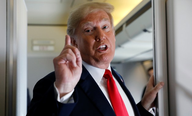 U.S. President Donald Trump speaks to reporters aboard Air Force One on his way to Fargo, North Dakota, U.S., September 7, 2018. REUTERS/Kevin Lamarque

