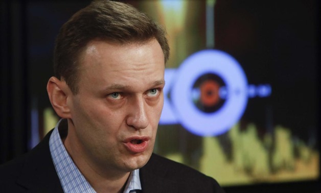 Russian opposition leader Alexei Navalny speaks in the studio of the radio station Echo of Moscow in Moscow, Russia December 27, 2017. REUTERS/Sergei Karpukhin
