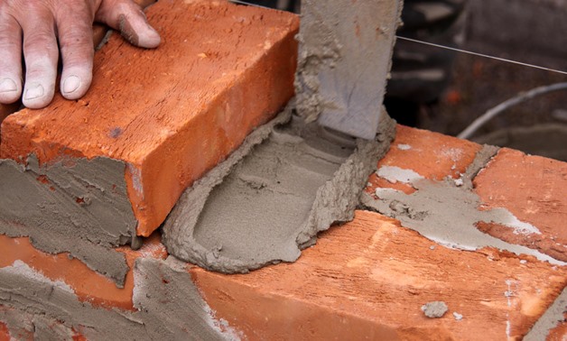 Causing the bricks to cement- CC viatorange.biz