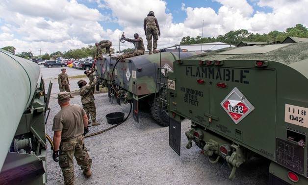 South Carolina National Guard soldiers transfer bulk diesel fuel into fuel tanker trucks for distribution in advance of Hurricane Florence, in North Charleston, South Carolina, U.S. September 10, 2018. U.S. Army National Guard/Sgt. Brian Calhoun/Handout v
