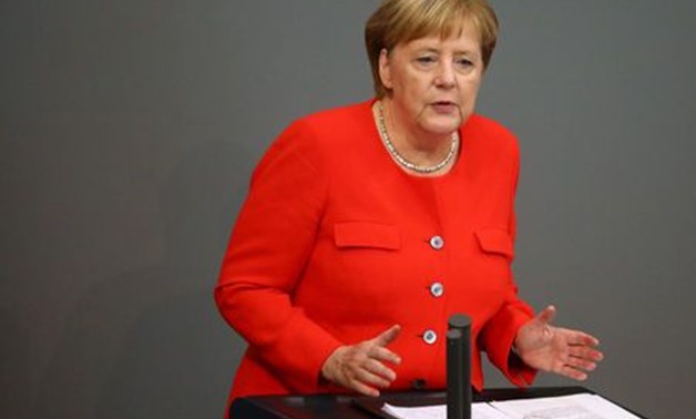 Germany's Merkel condemns far-right xenophobia, Nazi slogans