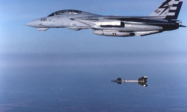  An F-14D Tomcat from the Naval Air Warfare Center at Patuxent River conducts a test drop of a laser-guided bomb- photo courtesy of the u.S. navy.