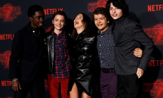 FILE PHOTO: Cast members (L-R) Caleb McLaughlin, Noah Schnapp, Millie Bobby Brown, Gaten Matarazzo and Finn Wolfhard pose at the premiere for the second season of the television series "Stranger Things" in Los Angeles, California, U.S., October 26, 2017. 