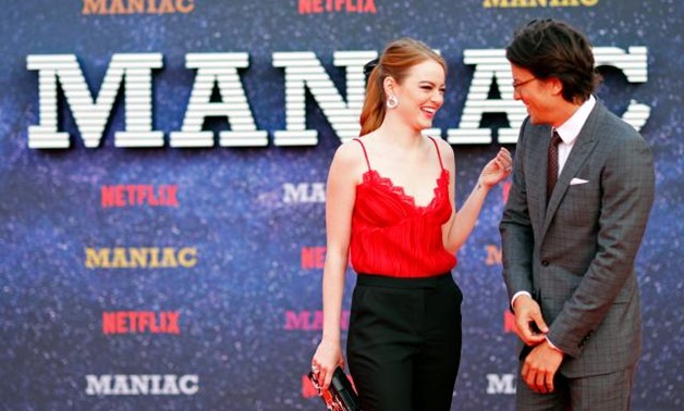Actor Emma Stone and director Cary Fukunaga attend the world premiere of the Netflix mini-series "Maniac", in London, Britain September 13, 2018. REUTERS/Eddie Keogh.