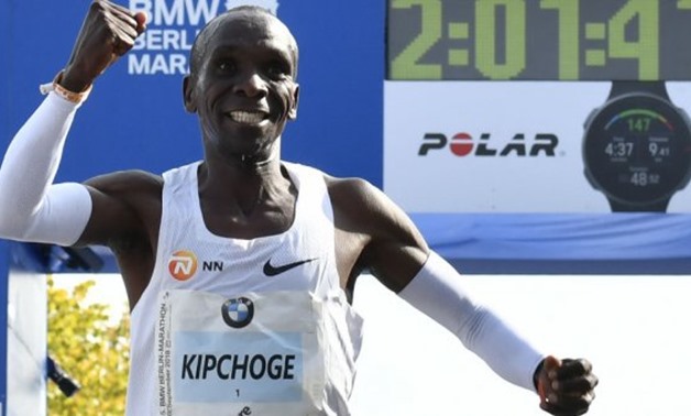 © John Macdougall, AFP | Kenya's Eliud Kipchoge celebrates winning the Berlin Marathon setting a new world record on September 16, 2018 in Berlin
