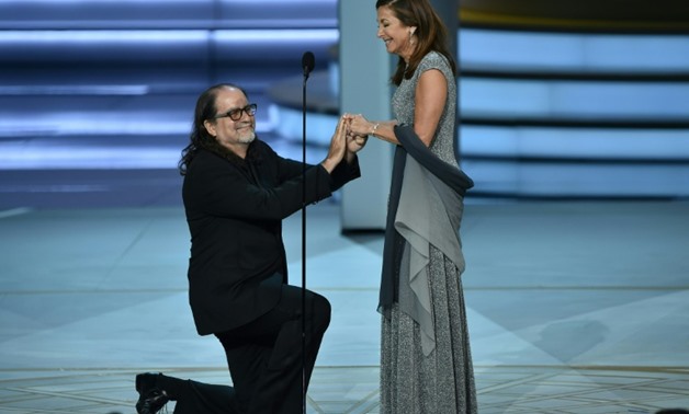 Glenn Weiss (L), winner of the Emmy for best directing of a variety special for 'The Oscars,' proposes to Jan Svendsen onstage during the ceremony.
